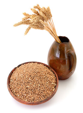 Wheat Grains in Ceramic Bowl with Ears in Clay Pitcher Isolated on White Background