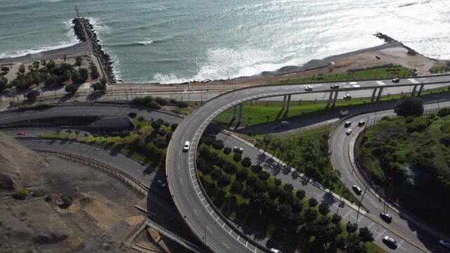 High angle view of cars driving along the circuito de playas highway on the pacific ocean coast