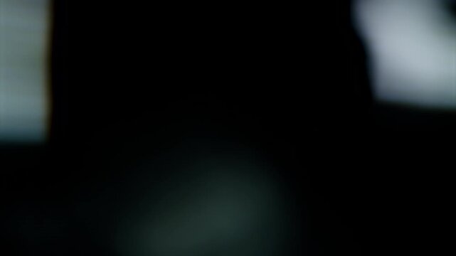 Cold Blue Bokeh Light Effects Flickering on Dark Background