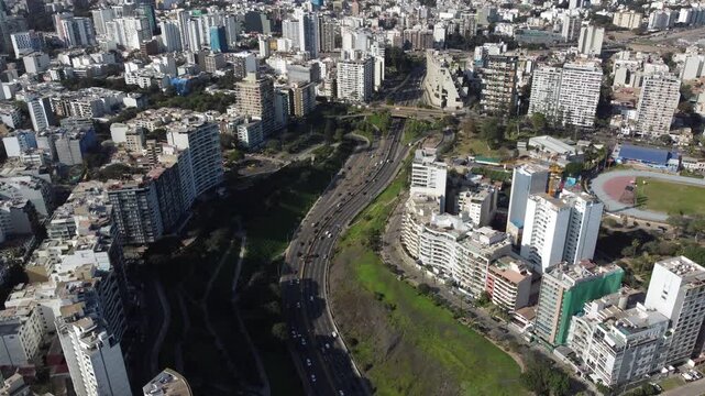 Aerial view of the urban landscape and traffic on avenida circuito de playas in miraflores, lima