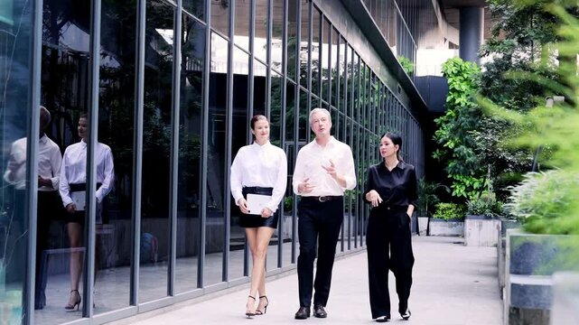 Professional business concept teamwork people work walking outdoors feeling determined achieve success while collaborating together office corridor