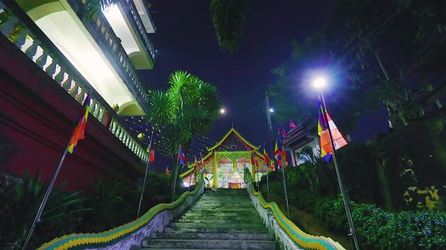Buddhist temple staircase at night in Huay Xai Bokeo Laos under the moon