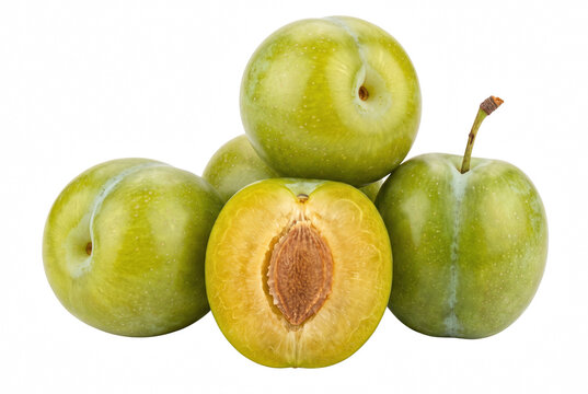Fresh green gage plums with one halved fruit showing internal pit