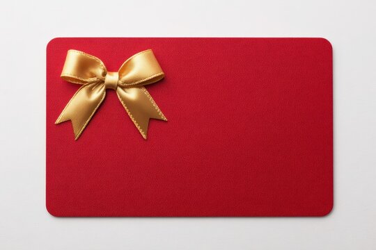 Gift card mock-up template. Red business card with gold ribbon bow accent. Prestigious blank voucher. Colorful coupon on white backdrop. Premium mockup, corporate reward, wedding favor layout. Flyer