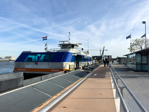 Dordrecht, Netherlands - 12 November 2025: Waterbus ferry docked in Dordrecht, dropping off and picking up passengers along the river quay, showcasing efficient public water transport.