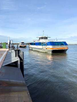 Dordrecht, Netherlands - 12 November 2025: Waterbus ferry arriving and docking in Dordrecht, preparing to pick up passengers along the river quay, showcasing efficient public water transport.