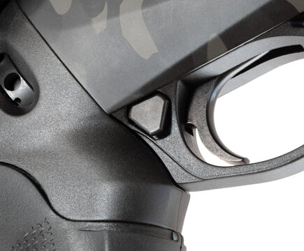 Very large button to disengage the safety faster on a shotgun