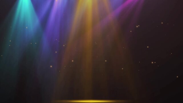 Colorful spotlights shining down on a dark stage with floating glowing dust particles in the air with beaming downwards floating golden particles against vibrant blue yellow