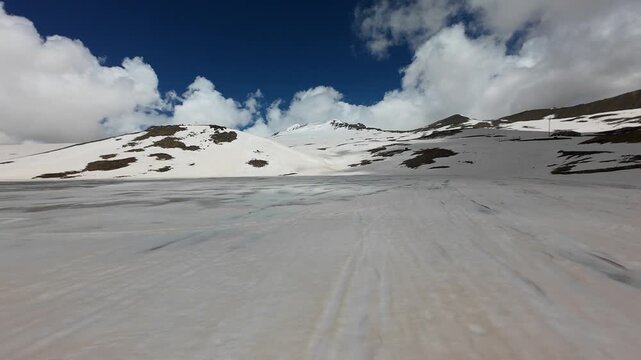 Aerial view of a vast snowfield on the slopes of Mount Aragats