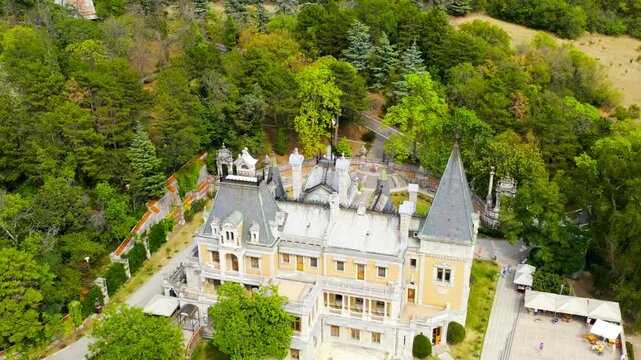 Masandra, Crimea. The Massandra Palace of Emperor Alexander III is located in the Upper Massandra on the southern coast of Crimea. Founding date XIX century. Drone footage, Departure of the camera