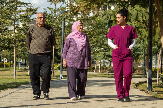 Seniors Walking with Caregiver 