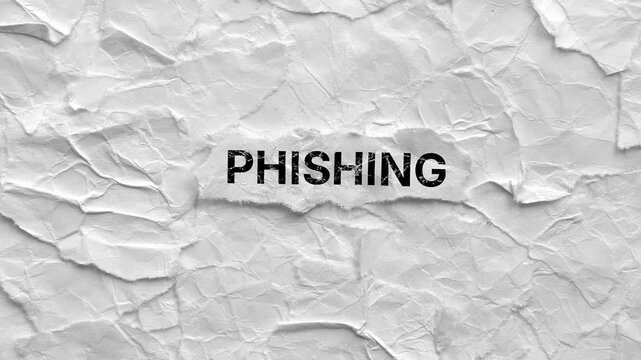 Crumpled piece of paper with word Phishing on a torn crumpled white paper pieces background. 