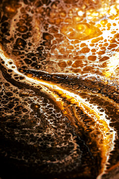 Water Bubbles on a Surface With Brown and White Patterns