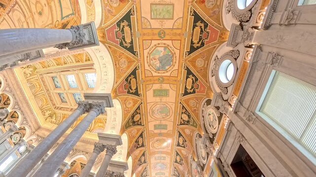 Washington, District of Columbia, United States - 27 September 2025: View of the ornate, frescoed ceiling and marble columns of the Library of Congress.