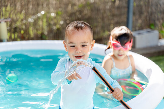Toddler Playing With Pool Water
