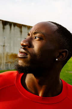 Close-up portrait of a professional athlete posing outdoors