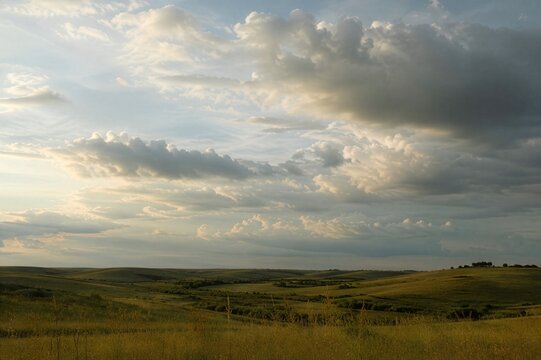 rolling midwest prairie with dramatic clouds