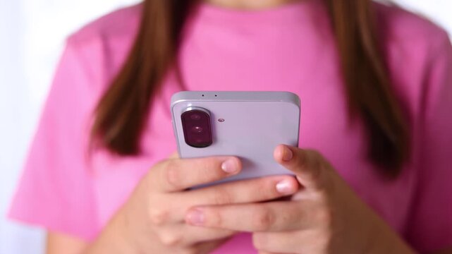Close up of a woman using a smartphone for communication, browsing, social media, online activities and digital interaction.