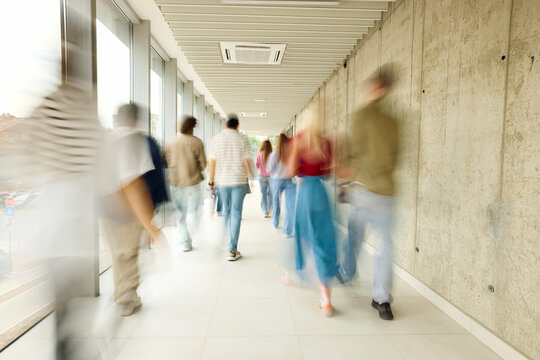 People Walking in a Busy Hallway