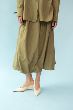 Crop of Model in Olive Khaki Shirt and Matching Balloon Midi Skirt