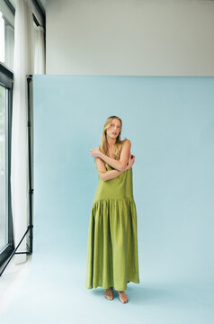 Full Length Studio Portrait of Blonde Model in Apple Green Maxi Dress