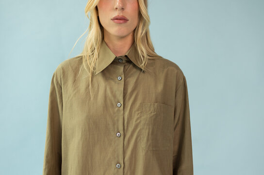 Studio Crop of Blonde Model in Oversized Olive Khaki Button-Down Shirt