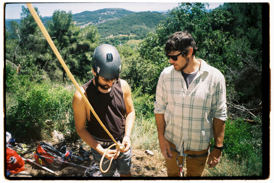 Two Climbers Prepare for a Rock Climbing 