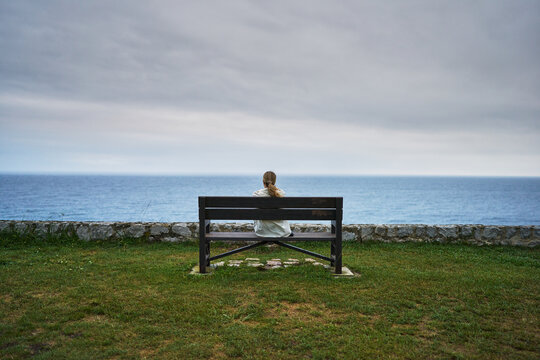 Lonely Reflection by the Ocean on a Bench
