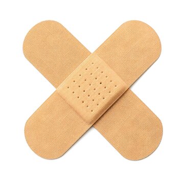 An adhesive bandage, also known as a plaster, crossed to form an X shape, isolated on a white background.