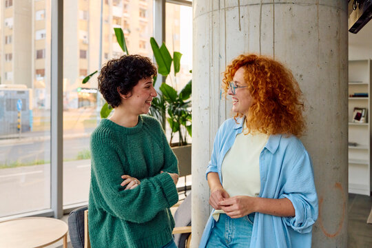 Classmates talking indoors