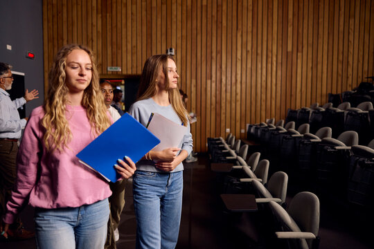 Students enter the lecture hall