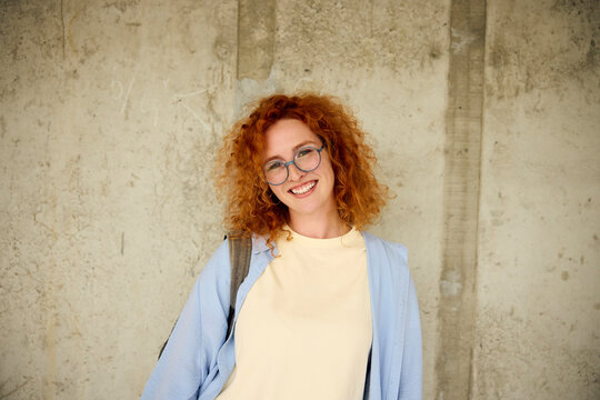 Portrait of a beautiful college-going woman smiling at the camera