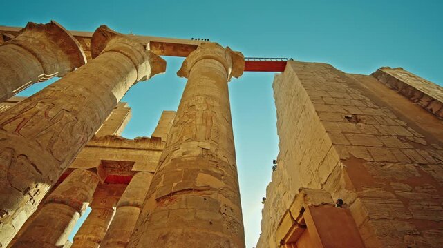 Hieroglyphic Columns Beside Stone Wall at Karnak Temple, Luxor
