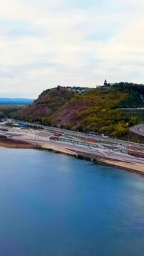 Vertical video. Ufa, Russia. Square named after Salavat Yulaev. Embankment of the Belaya River. Central part of the city. Drone footage. Rich colors