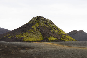 Naklejka premium 4x4 Vehicle Driving Through Rugged Volcanic Highlands of Iceland