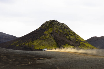 4x4 Vehicle Driving Through Rugged Volcanic Highlands of Iceland © Marius