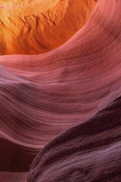 Beautiful vertical abstract texture of sandstone wave rock formation under ambient light