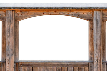Window opening in a snow-capped wooden wall isolated on white background © YK