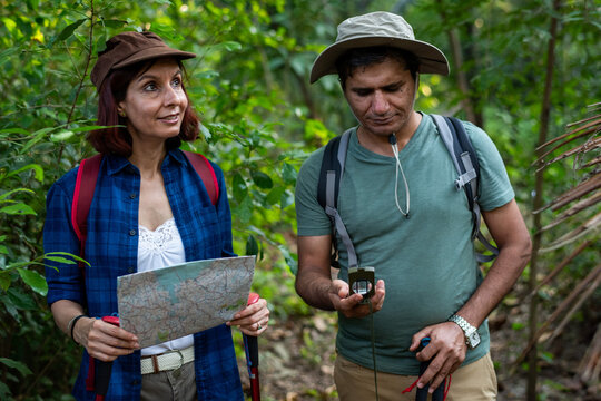 Explorers navigating lush jungle photo