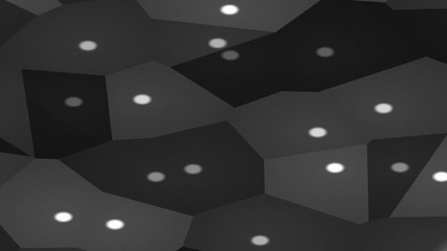 Abstract black and white geometric polygons shifting with glowing dots on a dark background