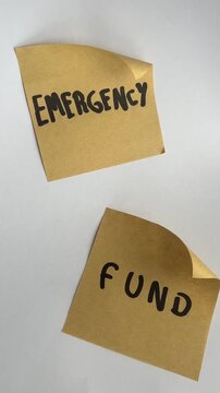Emergency fund sticky notes on white background top view