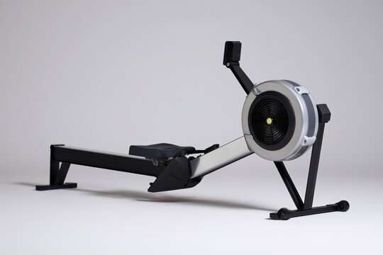Indoor rowing machine isolated on pale gray background three - quarter view
