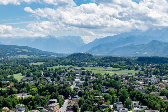 Aerial view of the outskirts of Salzburg and the mountains in the distance viewed from the Hohensalzburg Fortress
