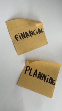 Financial planning sticky notes on white background top view