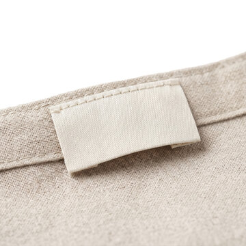 Blank clothing label tag on textured linen on transparent background