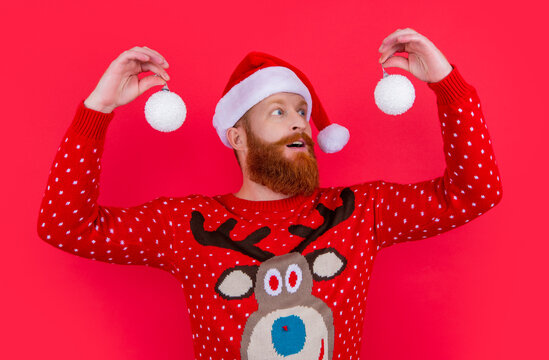 surprised santa man with new year decoration. new year holiday. santa man hold new year decoration