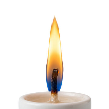 Close up lit candle wick with glowing flame illumination