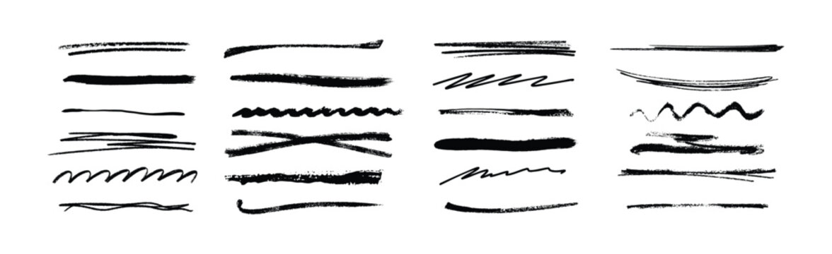 An assortment of abstract black painted brush strokes and artistic textures isolated on a clean white