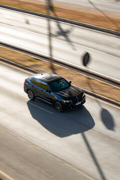 High Angle View of Black BMW X4 Driving on City Highway