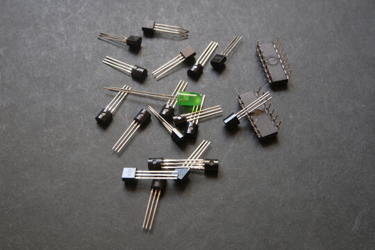 Green LED placed in the middle of a stack of semiconductor materials.